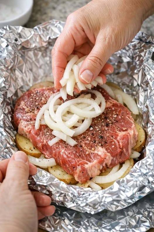 Layer onions and these 2 ingredients with steak for a baked dish you’ll never get tired of