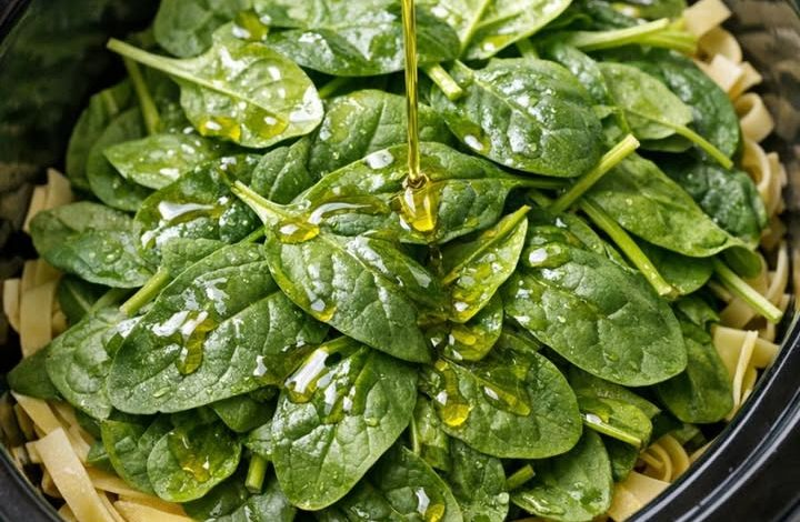 Add fresh spinach and pasta to the slow cooker with 4 simple ingredients for a meal so tasty your friends won’t stop asking for seconds